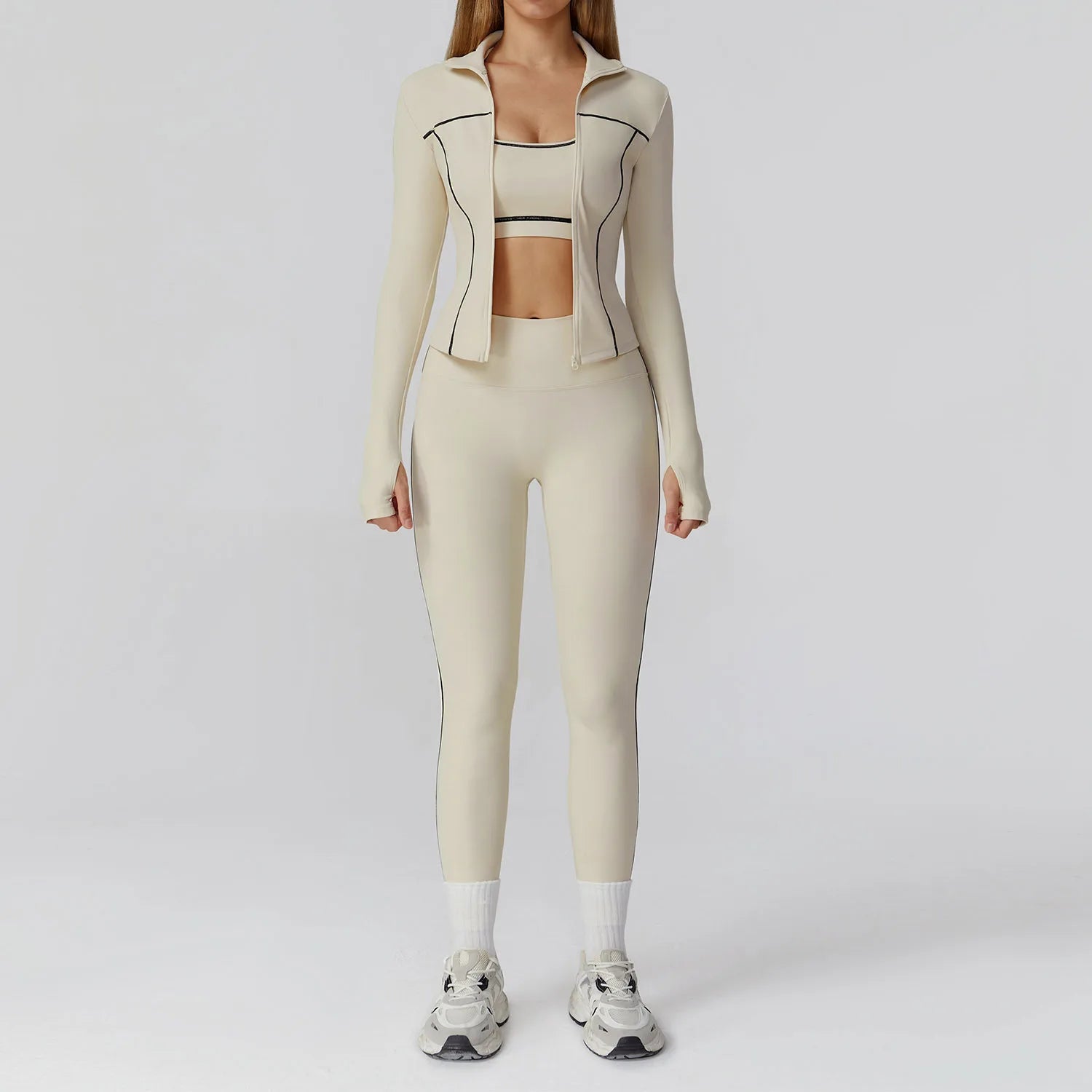Person wearing a beige athletic outfit on a white background