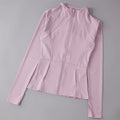 Pink long-sleeve top with a zipper on a gray background