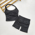 Black sports bra and shorts set on a white background