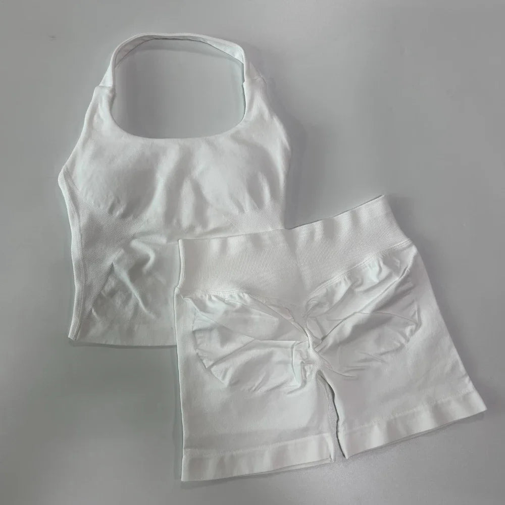 White tank top and shorts set on a grey background